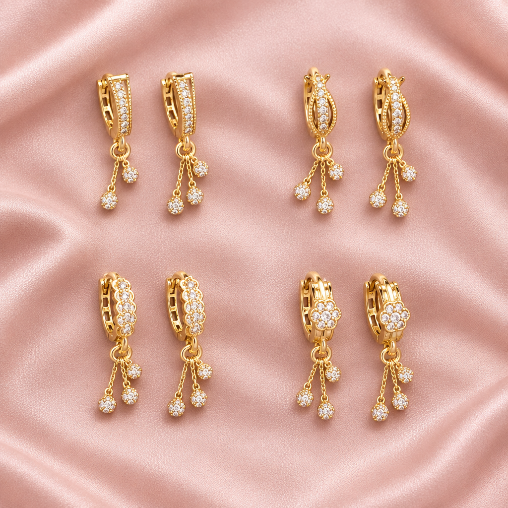 Gold plated drop earrings pink satin background