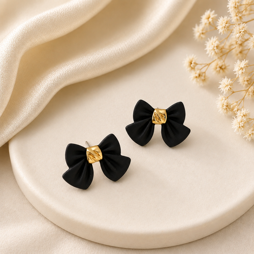 Black bow earrings white ceramic tray dried flowers