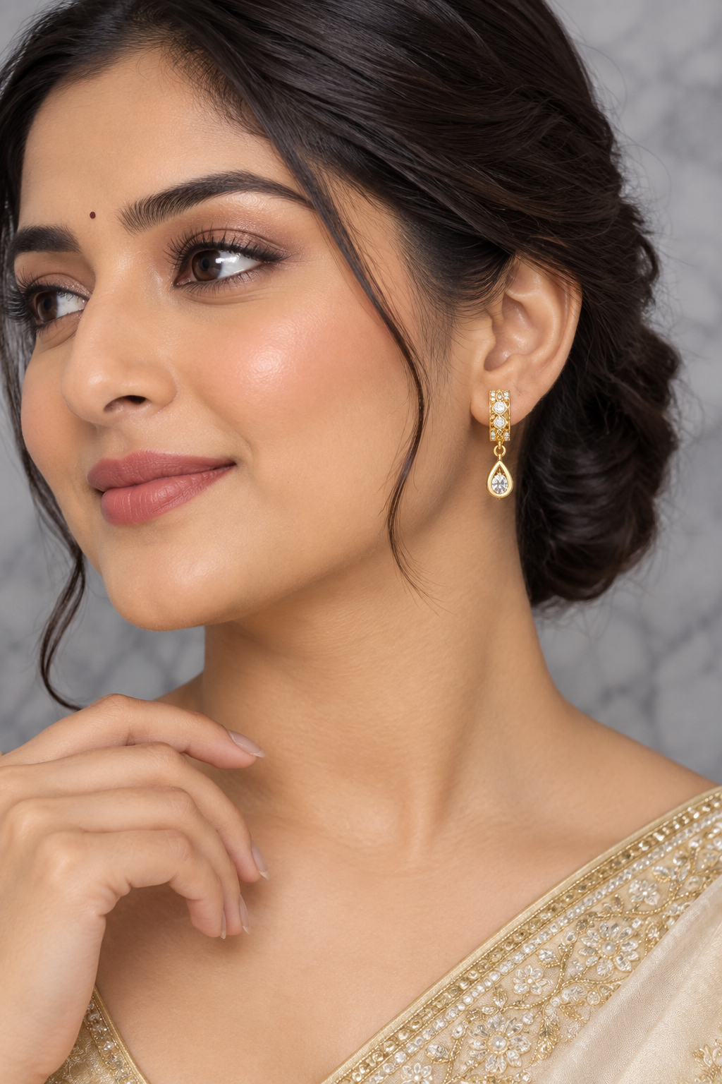Korean drop earrings on model grey marble background