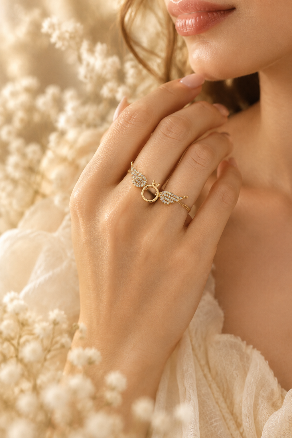 Angel wing ring on model dreamy cream background