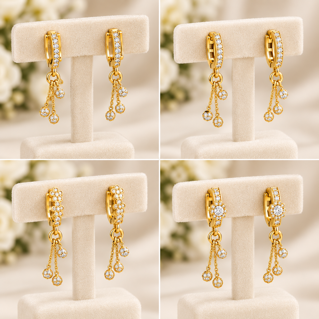 Gold plated drop earrings cream white background
